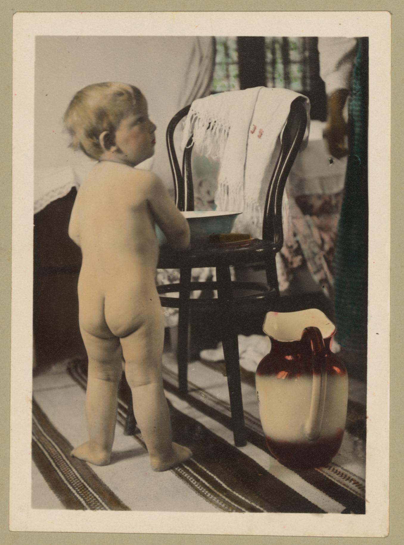 Vintage_Picture_of_a_Cute_Baby_Boy_About_to_Wash_Himself_with_a_Basin_and_Pitcher_of_Water
